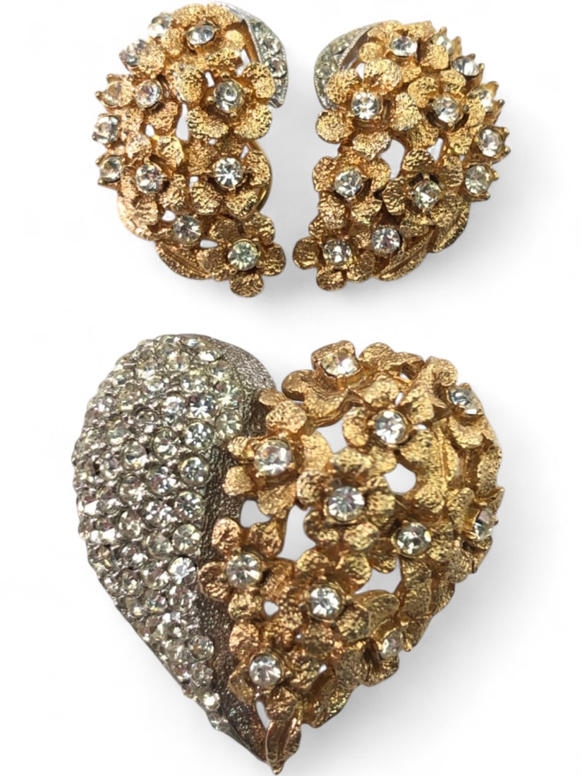 Gold-Tone and Rhinestone Heart Brooch and Earring Set: A matching jewelry set featuring a heart-shaped brooch and a pair of clip-on earrings. The pieces are crafted in a textured gold-tone metal with a floral motif, accented by clear round-cut rhinestones