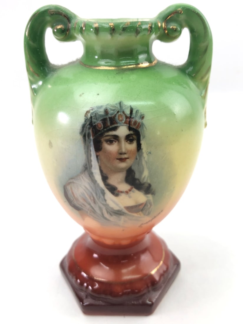 Austrian Porcelain Portrait Vase, Josephine: Hand-painted porcelain portrait vase featuring a depiction of Empress Josephine. The piece has a green and orange gradient ground with gilded accents on the rim, handles, and base. Marked on the under