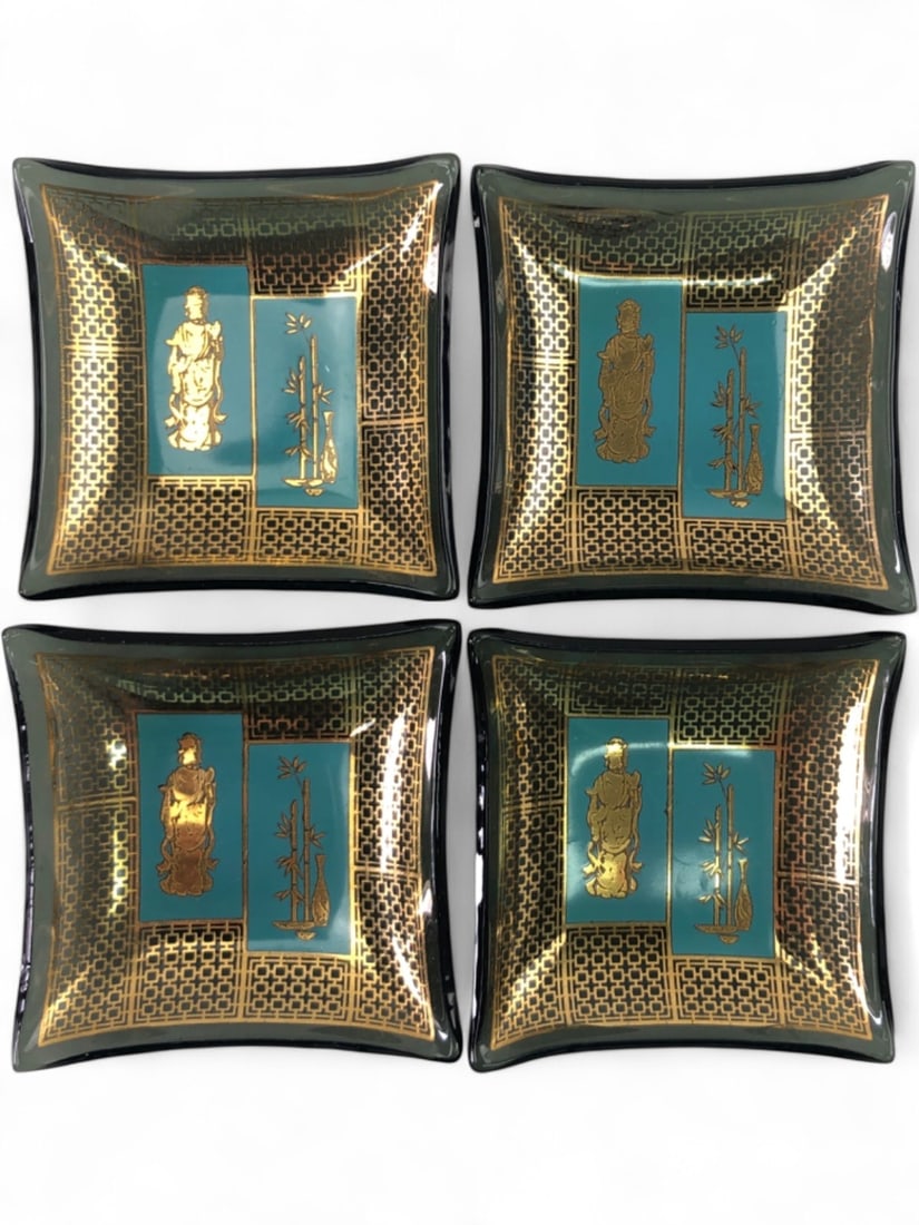 VTG Smoky Glass Trinket Dish Set with 24k Gold: Set of four vintage square trinket dishes crafted from smoky black glass. Each dish features a Chinoiserie motif with a turquoise blue background, a 24k gold accented figure of a deity, and bamboo sta