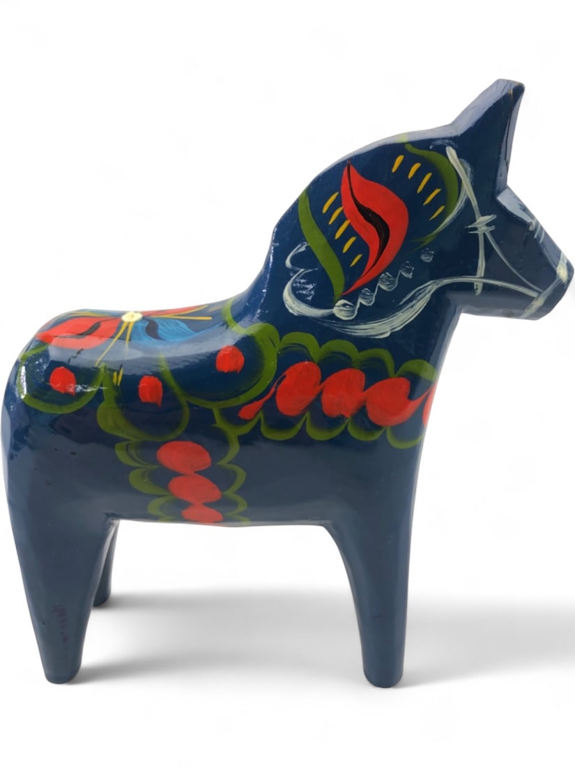 VTG Nils Olsson Swedish Dala Horse: Vintage hand-carved and hand-painted wooden Dala horse by Nils Olsson. Features a deep blue base with traditional kurbits floral motifs in red, green, and yellow. Retains original maker's label on und