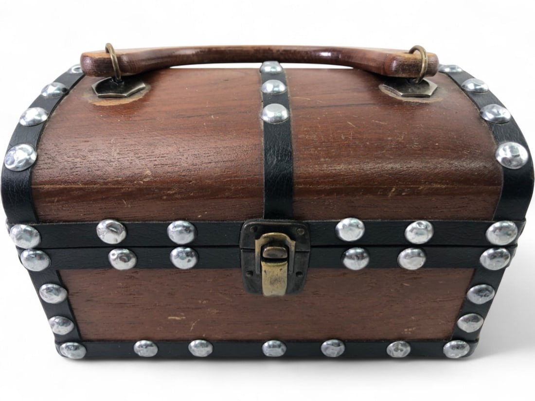 VTG Styled by Encore Wooden Treasure Chest Handbag: Vintage Styled by Encore wooden treasure chest handbag featuring a domed lid, black faux-leather straps with silver-tone metal studs, and a wooden arch handle. The interior is lined with red velvet an