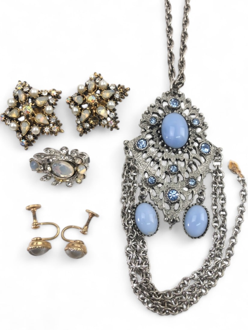 Vintage Moonstone Style and Rhinestone Jewelry Lot: A five-piece collection of vintage costume jewelry. Includes a pair of gold-tone screw-back earrings with heart-shaped grey moonstone-style cabochons, bearing a triangular maker's mark; a pair of star
