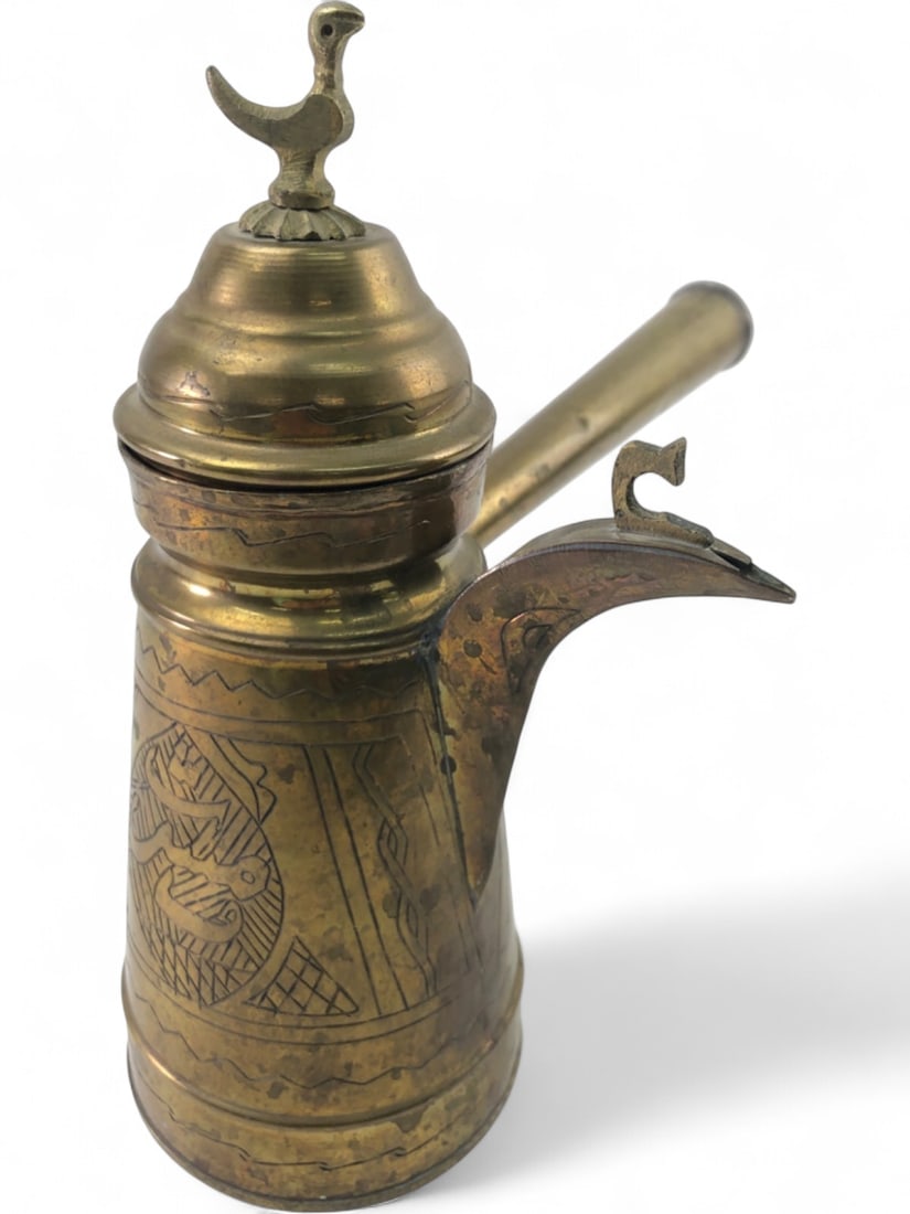 VTG Etched Brass Turkish Coffee Pot Dallah: Vintage brass Turkish coffee pot, or dallah, featuring hand-etched geometric patterns and Arabic calligraphy. The vessel includes a hinged lid topped with a bird finial, a long tapered handle, and a