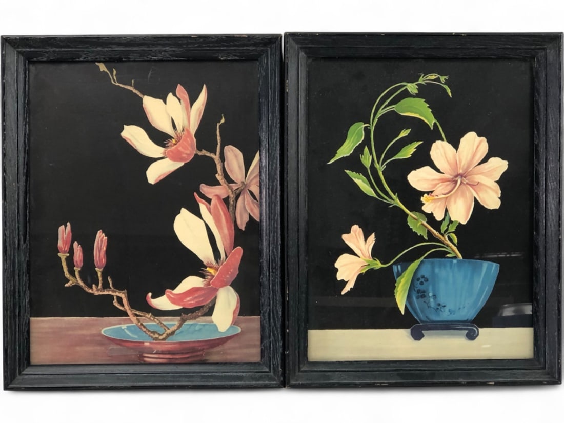 VTG Pr. Magnolia and Hibiscus Still Life Lithographs: Pair of vintage still life lithographs depicting magnolia and hibiscus floral arrangements in the style of Japanese ikebana. Each piece features vibrant blooms against a solid black background, set in