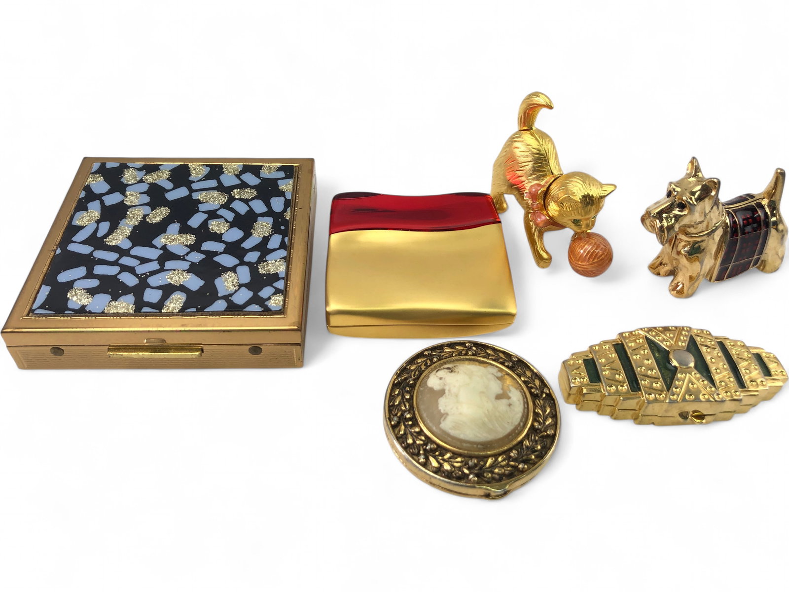 VTG Solid Perfume and Compact Set: Collection of three vintage Estée Lauder items including a 'Beautiful' solid perfume in a gold-tone square case with red inset, a 'Private Collection' solid perfume in a tiered gold-tone case, and a 