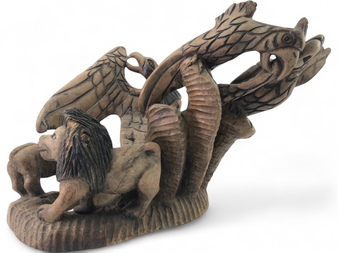 Hand-Carved Wood Figural Group with Lions and Eagles: Hand-carved solid wood sculpture featuring a dynamic scene of two lions and three eagles. The piece is carved from a single block of wood with visible chisel marks and textured details. Unsigned and