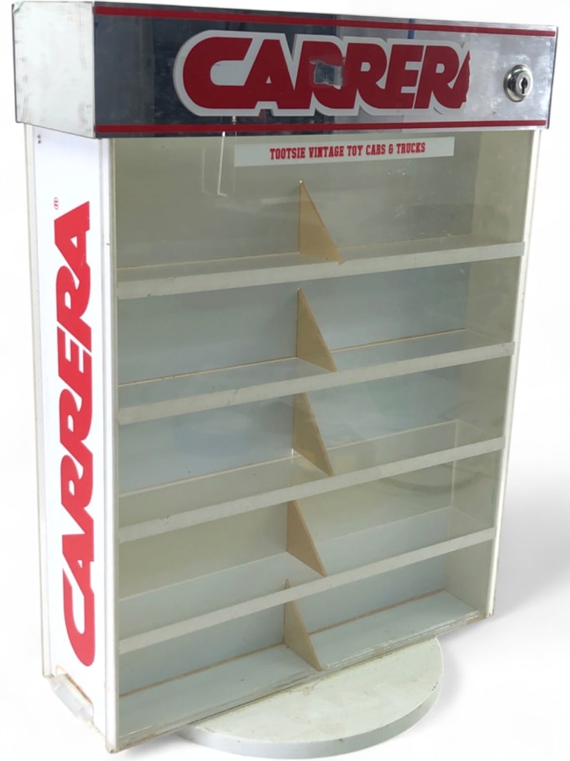 VTG Carrera Rotating Tootsie Toy Display Case: Vintage Carrera rotating acrylic display case, featuring a white plastic frame with clear shelving and a mirrored header. The header bears the Carrera logo and a label for "Tootsie Vintage Toy Cars & 