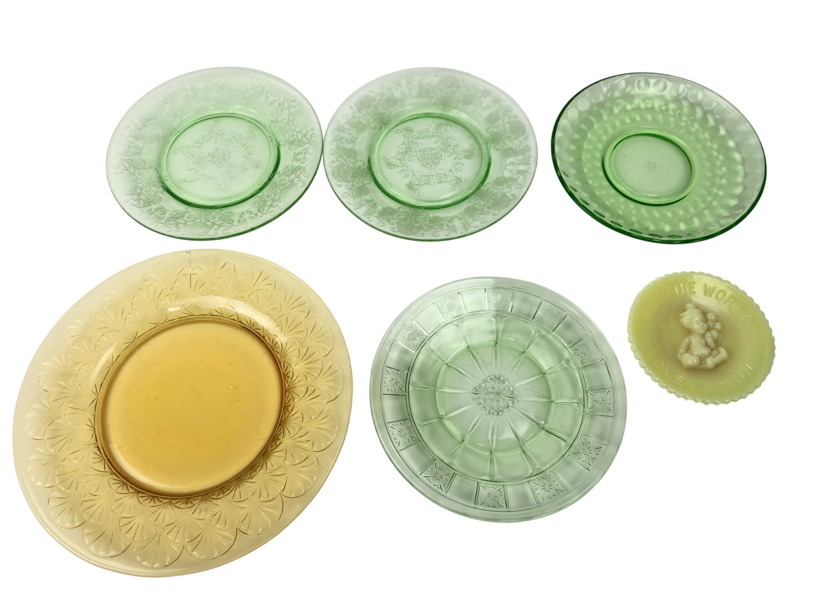 Federal Glass and Others, Uranium Glass Plates: Collection of six assorted glass plates, including 1 green uranium glass and yellow custard glass plates. Features a Federal Glass 'Patrician' pattern plate (approx. 6" dia.) with a shield mark, two e