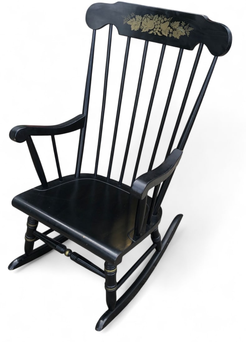 VTG Hitchcock Chair Co.-Style Boston Rocker: A vintage Boston rocker in the style of the Hitchcock Chair Co., featuring a matte black finish with gold-toned stenciled leaf and fruit embellishments. Measures 23"w x 40"h.