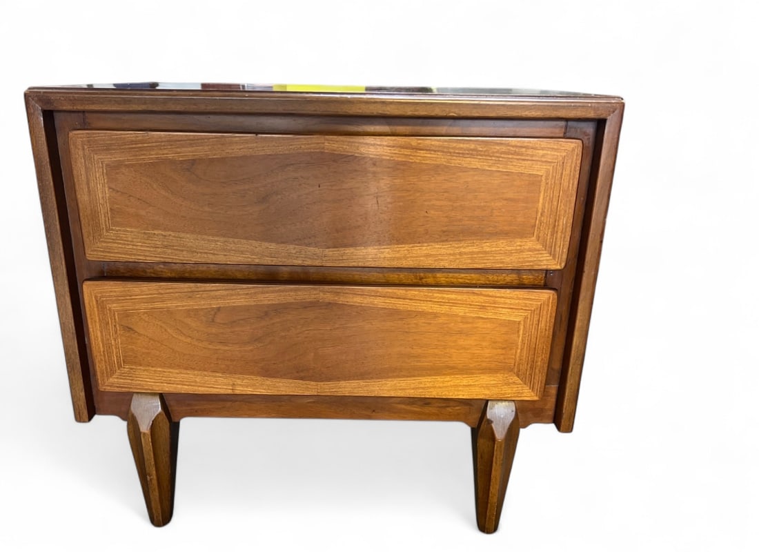 MCM American of Martinsville Two-Drawer Nightstand: Mid-Century Modern nightstand by American of Martinsville. Features two drawers with diamond-shaped veneer inlay and tapered legs. Stamped "American of Martinsville" inside drawer. Back panel marked