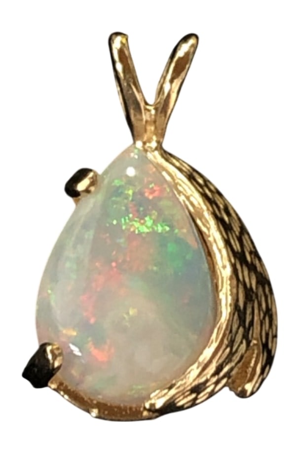 14K Gold Pear Shaped Opal Pendant: A pear shaped opal pendant set in 14 karat yellow gold. The opal displays a vibrant play-of-color with flashes of green and orange. The setting features a textured gold border on one side and a