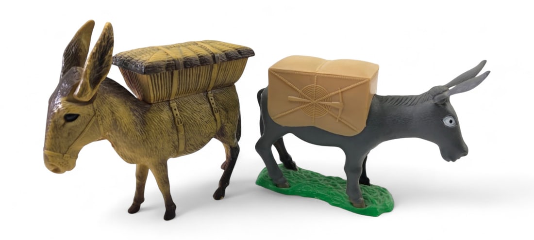 VTG Molded Plastic Donkey Cigarette Dispensers: Pair of vintage molded plastic donkey-form cigarette dispensers. One features a brown and tan textured finish with a woven basket-style lid, while the other is grey with a smooth tan pack-style lid an