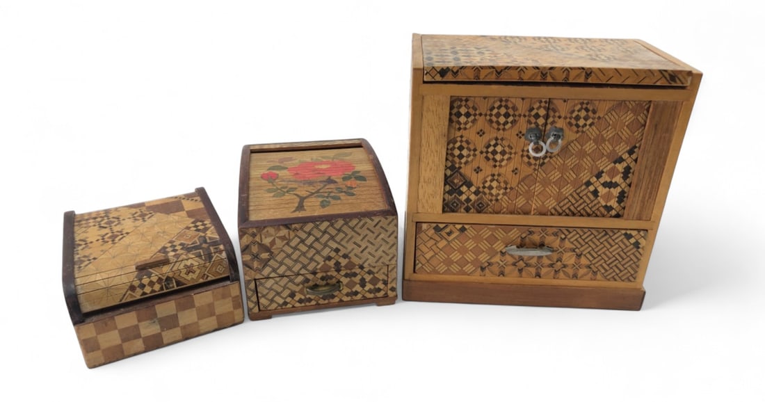Japanese Yosegi-Zaiku Marquetry Box Set: Set of three Japanese Yosegi-Zaiku marquetry boxes, including a small chest with double doors and drawer, a box with a sliding lid featuring a floral motif, and a smaller box with a curved sliding lid