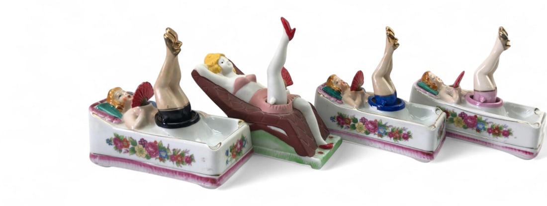 VTG Porcelain Moving Ladies Legs and Fan Ashtrays: Set of four vintage porcelain novelty ashtrays featuring reclining pin-up style figures. Three ashtrays are designed as bathtubs with floral motifs and gold-tone accents, while one is shaped like a