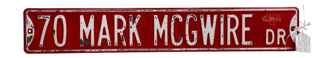 Mark McGwire Signed Busch Stadium Street Sign: Embossed metal street sign for "70 Mark McGwire Dr," featuring an autograph in gold ink attributed to Mark McGwire. The sign measures 36x6" and displays the MLB Players Choice logo on the reverse.
