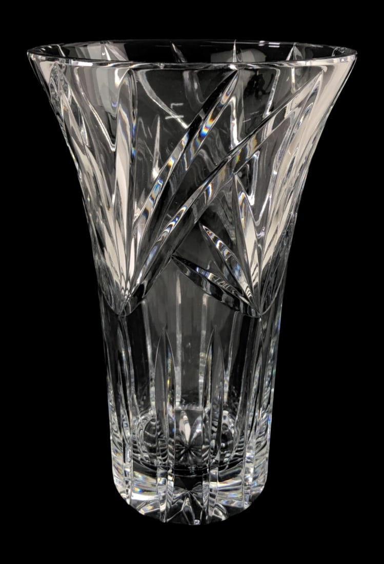 Cut Crystal Vase with Starburst Base: Large cut crystal vase featuring a flared rim and intricate geometric patterns. The design includes deep vertical cuts on the lower half and intersecting diagonal cuts forming leaf-like motifs on the