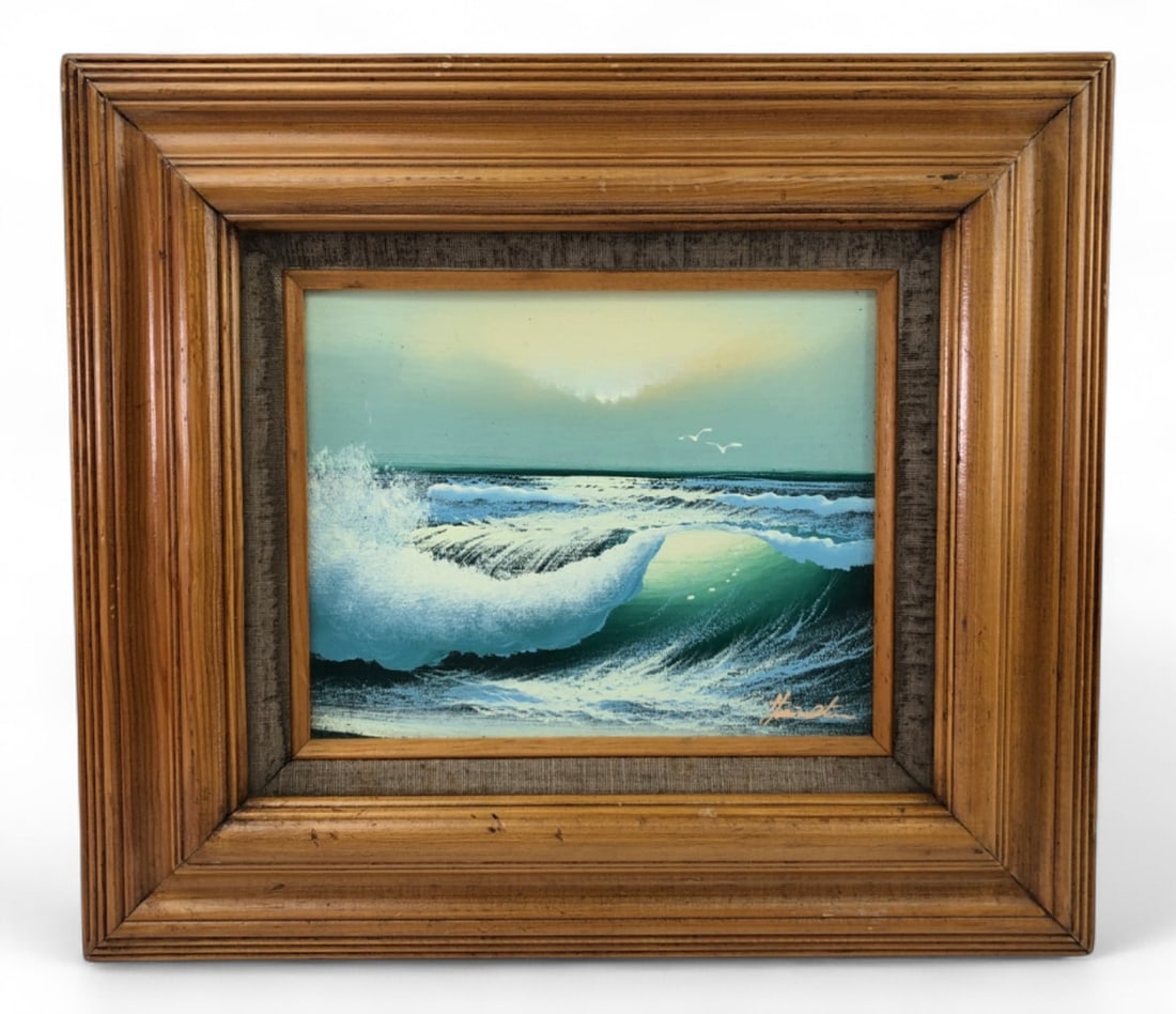 Signed Seascape Oil on Board Painting: Original oil on board painting depicting a crashing ocean wave under a hazy sky with seagulls. Signed by the artist in the lower right corner. Housed in a heavy, multi-tiered wood frame with a linen l
