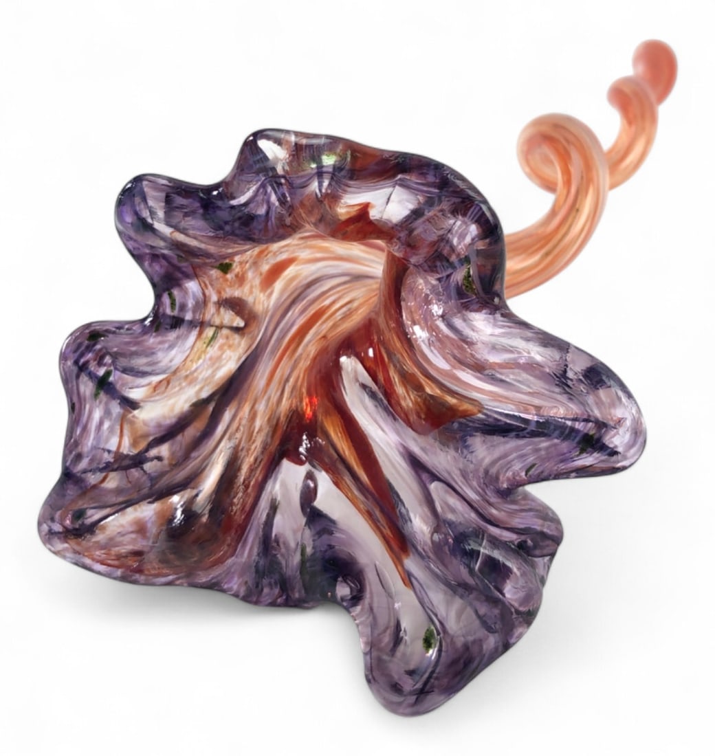 Hand-Blown Art Glass Flower Sculpture, 11" H: Hand-blown art glass flower sculpture featuring a ruffled purple and clear glass bloom with an orange and white swirled interior. The piece transitions into a long, spiraling orange and white stem. Un