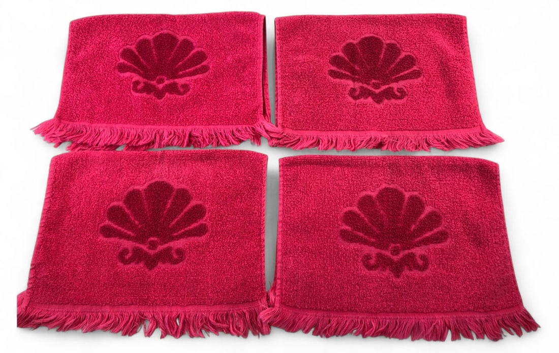 VTG Fieldcrest Cotton Hand Towels, Shell Design (4): Set of four vintage hand towels by Fieldcrest. Crafted from 100% cotton in a vibrant pink hue, each towel features an embossed seashell motif and fringed edges. Made in the U.S.A. Excellent