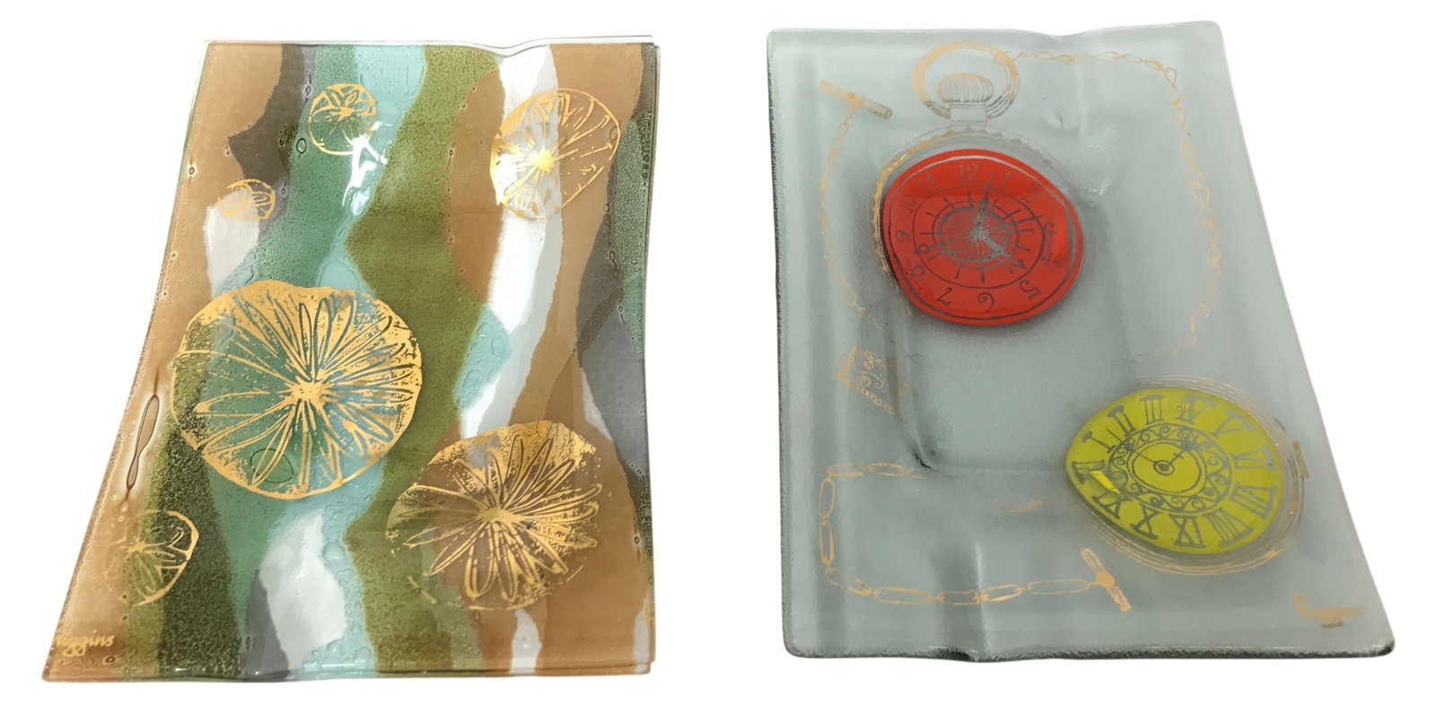 MCM Higgins Fused Art Glass Tray Pair: Pair of Mid-Century Modern fused art glass trays by Higgins. Includes one tray with an abstract organic motif in shades of green, brown, and gold, and one tray featuring a pocket watch design in red a