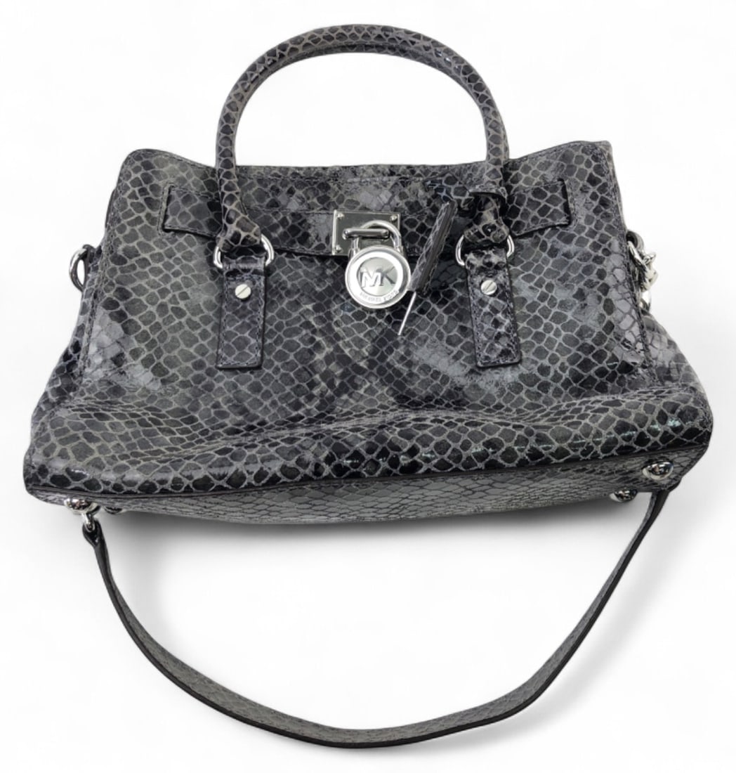 Michael Kors Hamilton Satchel in Python-Embossed Leather: Michael Kors Hamilton satchel featuring a grey and black python-embossed leather exterior. This bag includes a signature MK padlock and key charm, dual rolled handles, and a chain-link shoulder