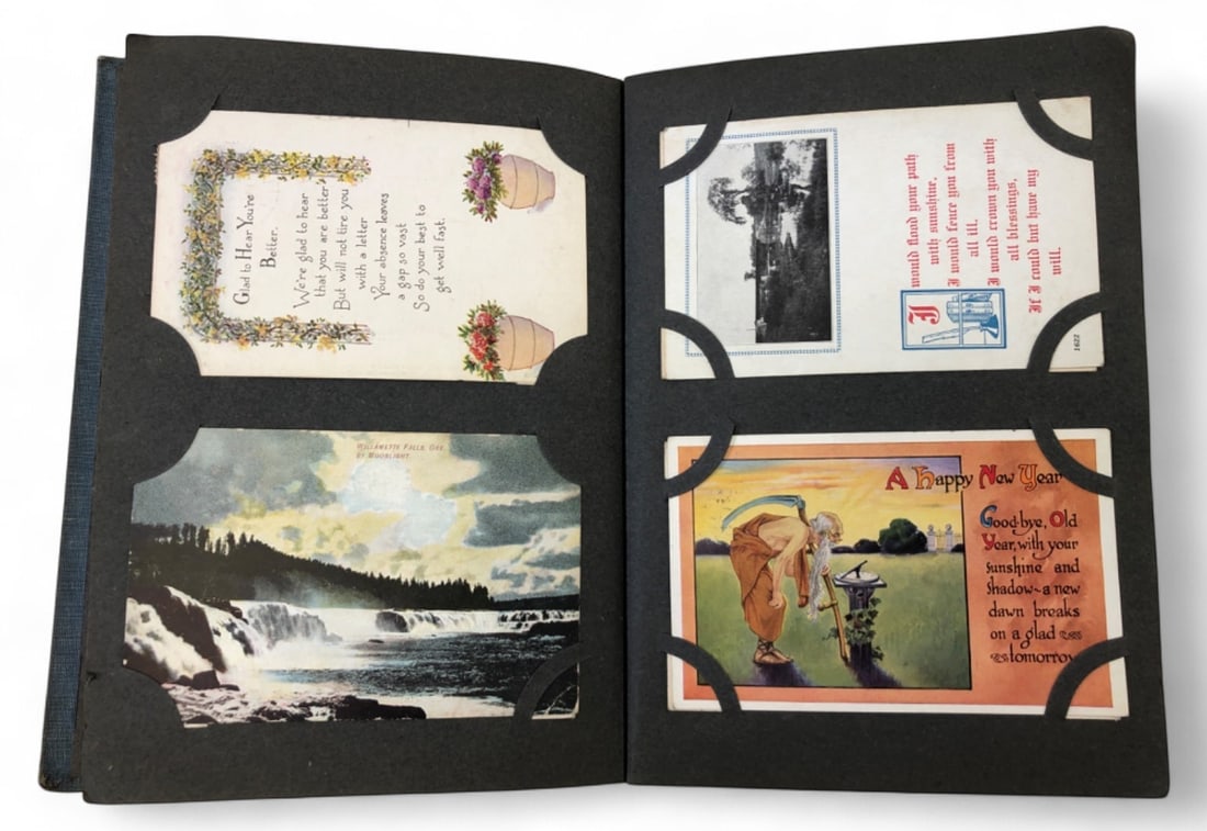Antique Postcard Album with Holiday and Scenic Cards: Antique postcard album. Includes holiday greetings for Christmas, New Year, Thanksgiving, and Easter, as well as scenic views of Michigan and Oregon. Features embossed details, lithographs, and real