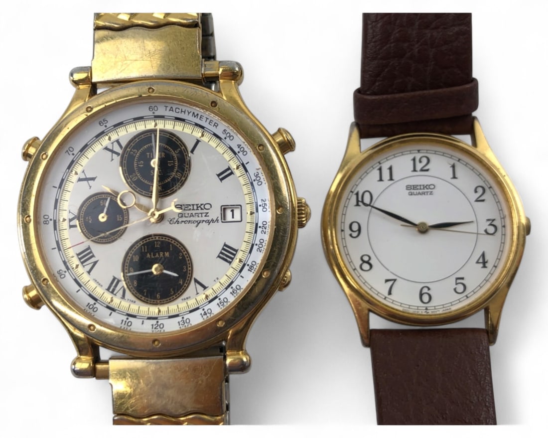 Seiko Quartz Chronograph and Seiko Quartz Watch Pair: Two Seiko quartz wristwatches. The first is a gold-tone chronograph with a tachymeter bezel, Roman numeral indices, and a Speidel expansion band. The second is a gold-tone watch with a white dial, Ara