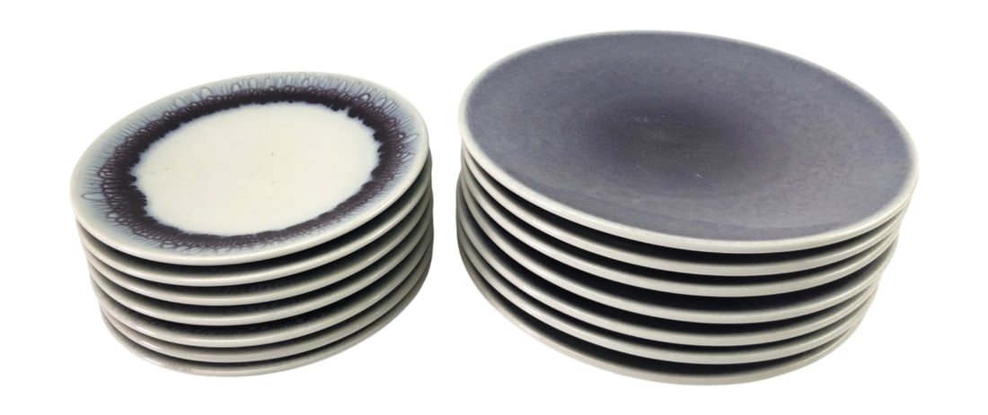 Jars France Stoneware Plates, Set of 14: Set of 14 stoneware plates by Jars France. Includes seven 10.5" diameter dinner plates in a solid mottled purple glaze and seven 8" diameter salad plates featuring a cream center with a dark purple an
