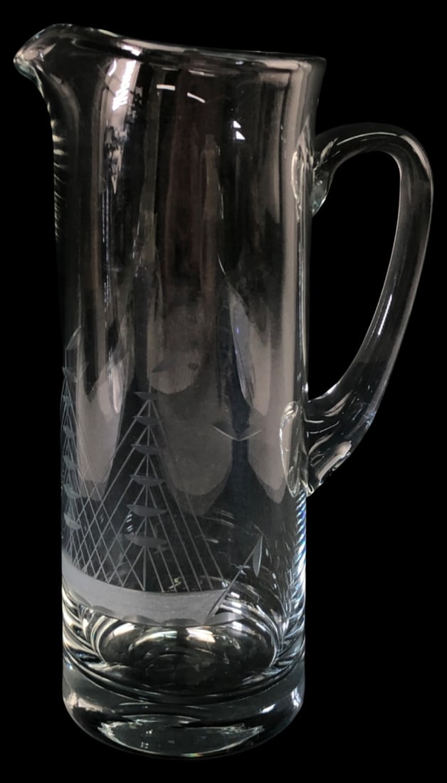 MCM Etched Crystal Ship Martini Pitcher, 10.5" H: Mid-Century Modern clear crystal martini pitcher featuring a detailed etched ship motif. The vessel includes a sturdy handle and a pour spout. Measures 10.5" H. Condition appears good with no visible 