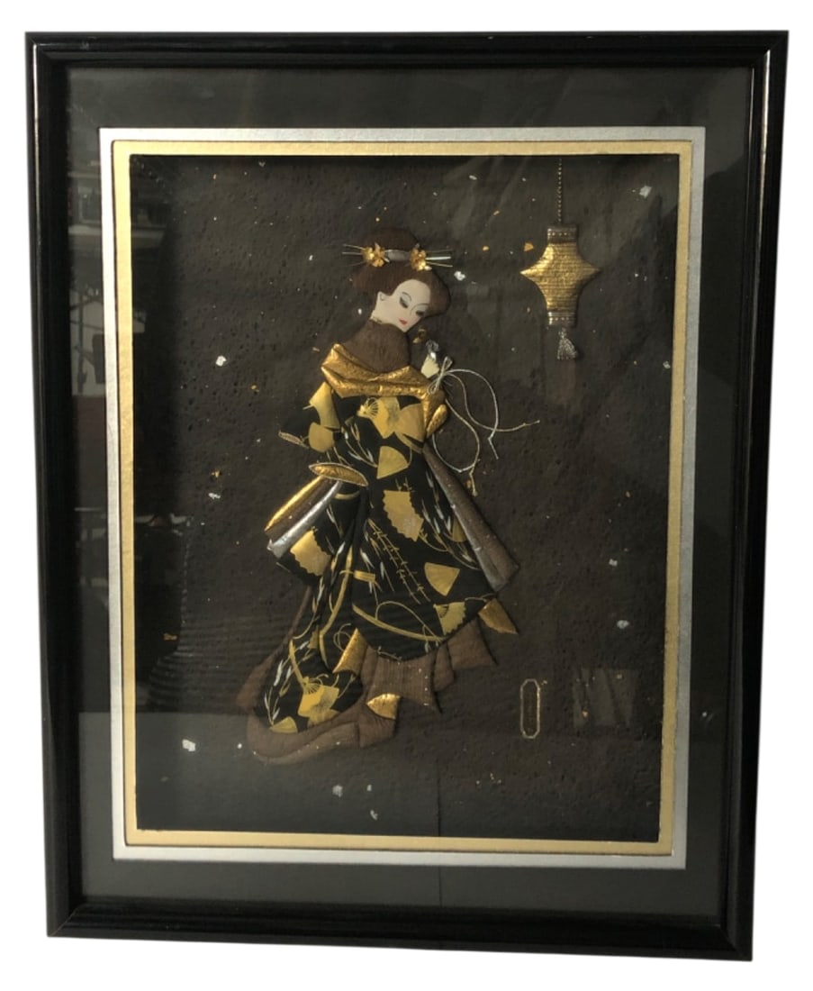 JGS Paper Expressions 3D Paper Geisha Art: Framed 3D paper art depicting a Japanese geisha in a gold-accented kimono, created using folded paper. Housed in a black shadowbox frame. Back bears a label for JGS Paper Expressions. Artwork