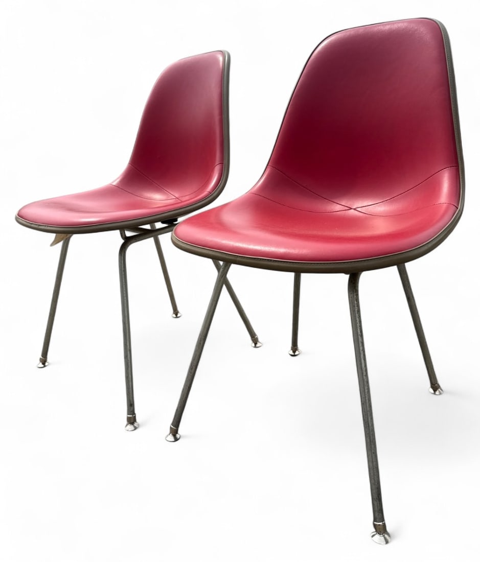 MCM Herman Miller Eames DSX Padded Shell Chairs: Pair of 1950s Herman Miller Eames DSX fiberglass side chairs. Features red padded upholstery over molded fiberglass shells on metal H-bases. Embossed Herman Miller logo and patent labels on