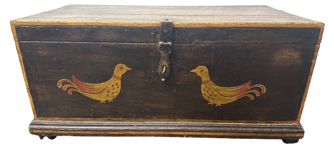 Folk Art Painted Wood Blanket Chest: Folk art wooden blanket chest featuring hand-painted yellow and red birds on a dark ground with yellow-painted borders. Features a brass hasp with stamped decorative motifs, iron side carrying handles