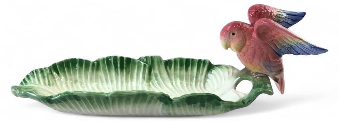 VTG Fitz & Floyd Parrot Banana Leaf Serving Dish: Vintage ceramic serving dish by Fitz and Floyd, dated 1986. Features a green banana leaf form with a sculpted pink and blue parrot perched on the handle. Marked "© FF 1986" on the base. Measures 14