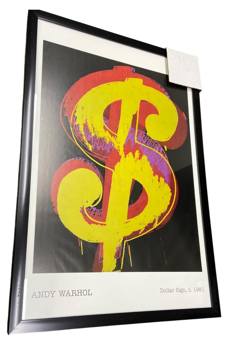 Andy Warhol Dollar Sign Poster: Framed Andy Warhol "Dollar Sign, c. 1981" poster. Features a large yellow dollar sign on a black background with red and purple accents. Printed text at bottom reads "ANDY WARHOL" and "Dollar Sign,