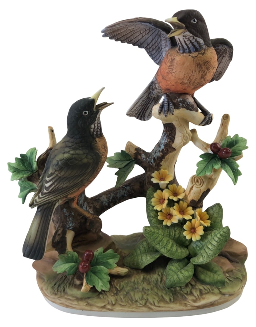 Robin by Andrea Ceramic Bird Figurine 10" H: Ceramic figurine featuring two robins perched on a branch with yellow flowers and red berries. Marked "Robin by Andrea" on the base. Hand-painted with a matte bisque finish. Measures 10" H. Shows
