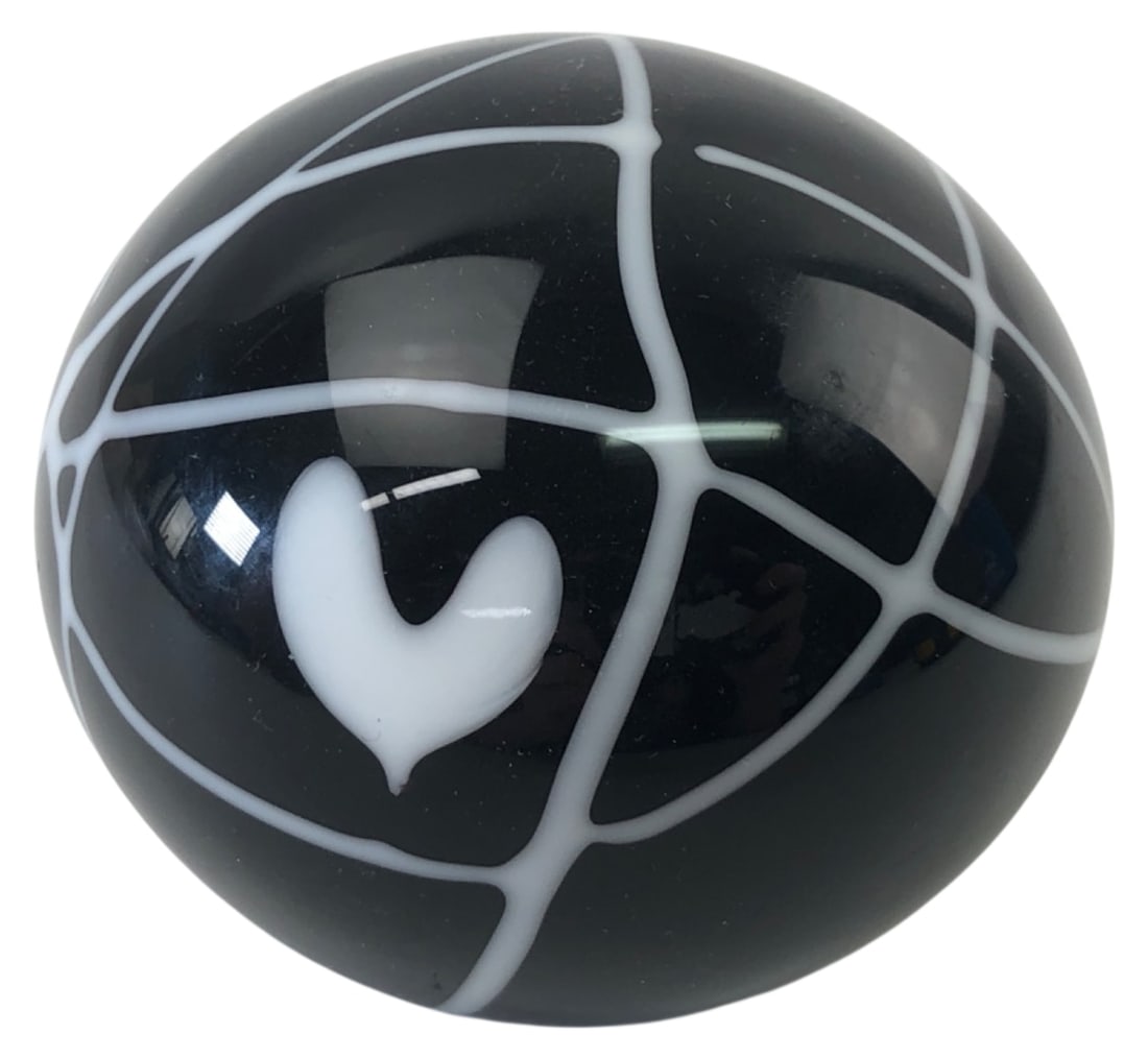 Rare Terry Crider Art Glass Paperweight: Rare art glass paperweight by renowned self-taught American glass artist Terry Crider. Features a black spherical body with a white trailed glass web and heart motif. Signed and dated "Terry Crider