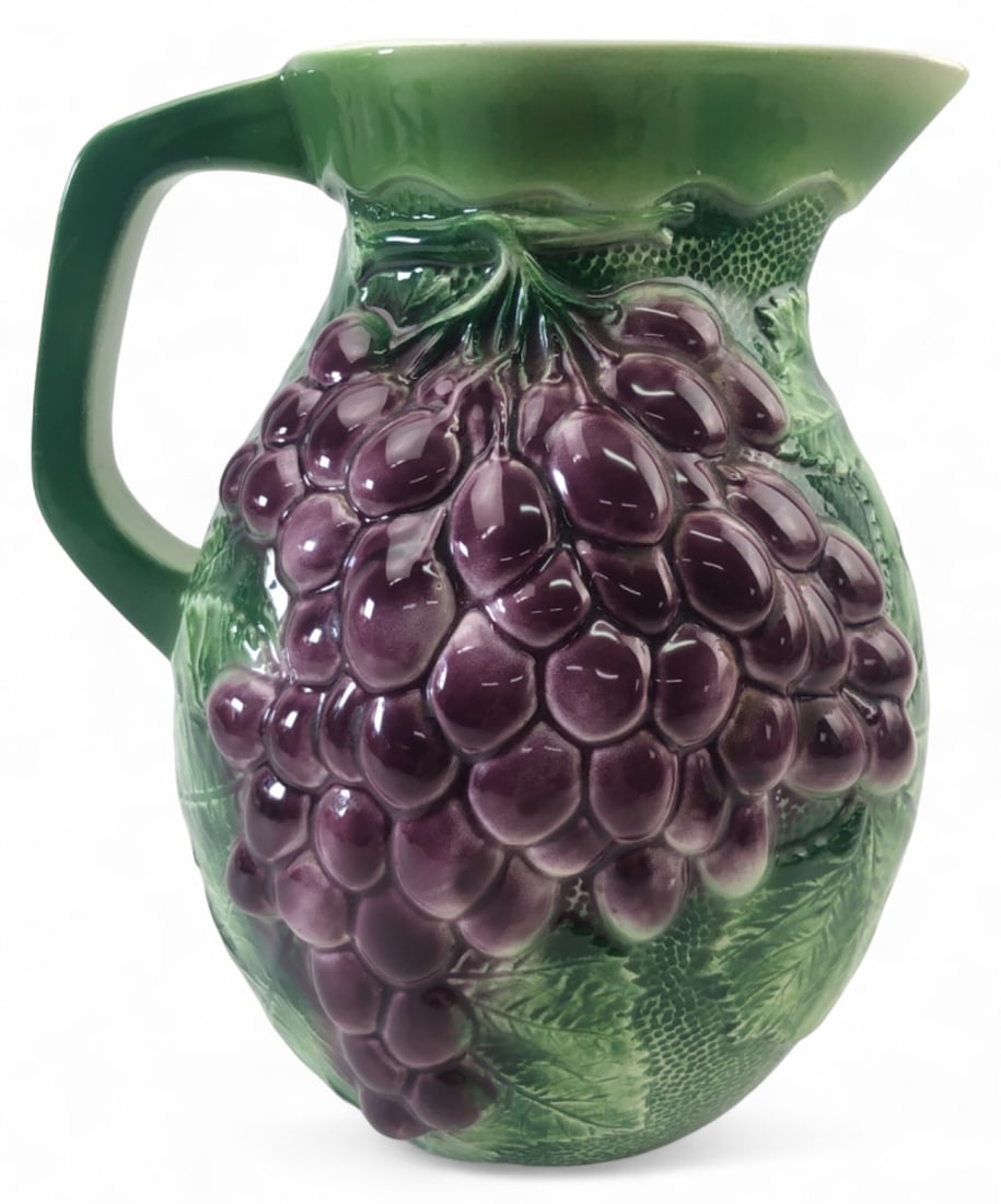 VTG Italian Majolica Grape Pitcher: Vintage Italian majolica ceramic pitcher featuring a high-relief purple grape and green leaf motif against a textured background. Base is stamped "MADE IN ITALY" with impressed numbers "6741". Measure