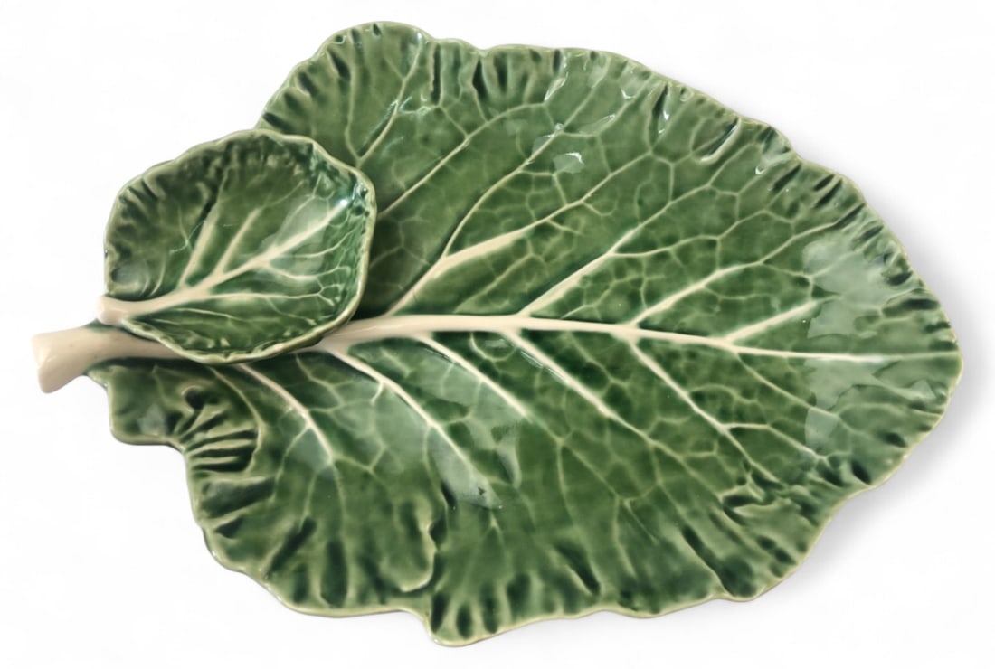Bordallo Pinheiro Majolica Cabbage Serving Dish: Bordallo Pinheiro textured earthenware serving dish featuring a large cabbage leaf design with an attached smaller leaf bowl. Finished in a vibrant green glaze. Base features three small feet and is s