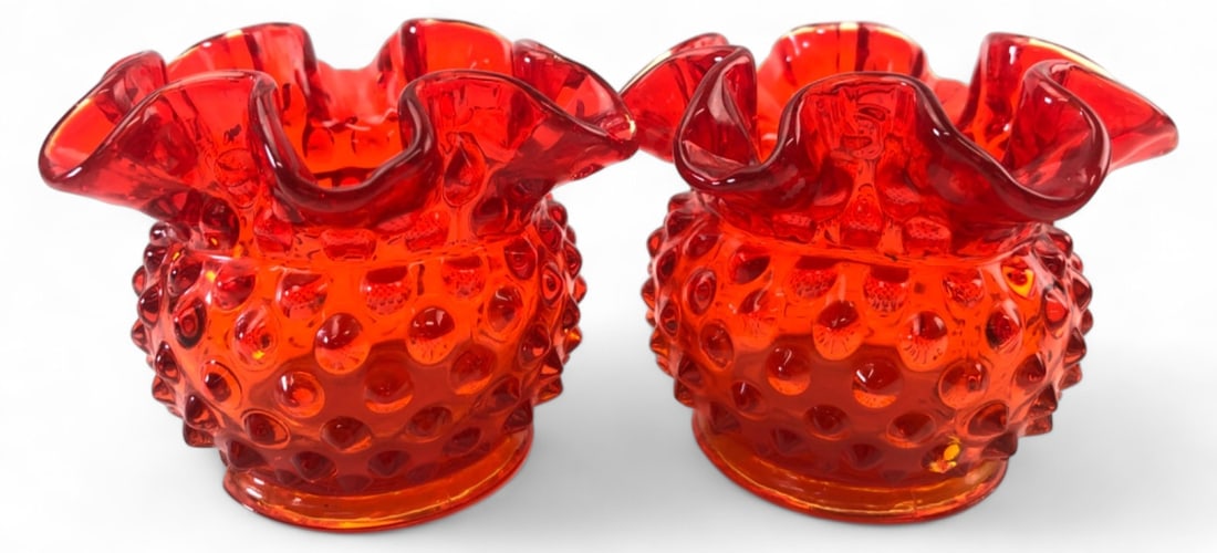 VTG Fenton Amberina Hobnail Ruffled Vase Pair: Pair of vintage Fenton art glass vases in amberina red with a hobnail pattern and ruffled rims. The yellow bases glow under UV light. Marked with the Fenton oval logo on the bottom. Measure 3" H. Cond