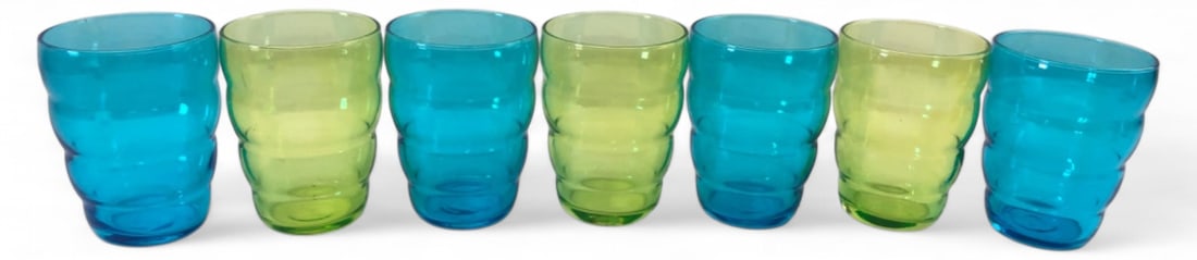 IKEA Skoja Beehive Tumblers Set of 7: Set of seven discontinued IKEA Skoja beehive tumblers. Includes four blue and three green glasses featuring a ribbed design. 4 1/8" H. Good condition, showing light wear.