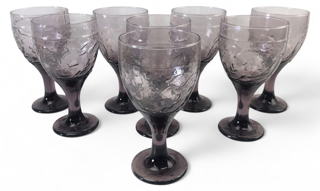 VTG Libbey Garden Vase Amethyst Water Goblets: Set of 8 vintage Libbey water goblets in the Garden Vase pattern. Features textured amethyst glass with embossed leaf motifs and a flared stem. Good condition with no obvious chips or cracks visible. 
