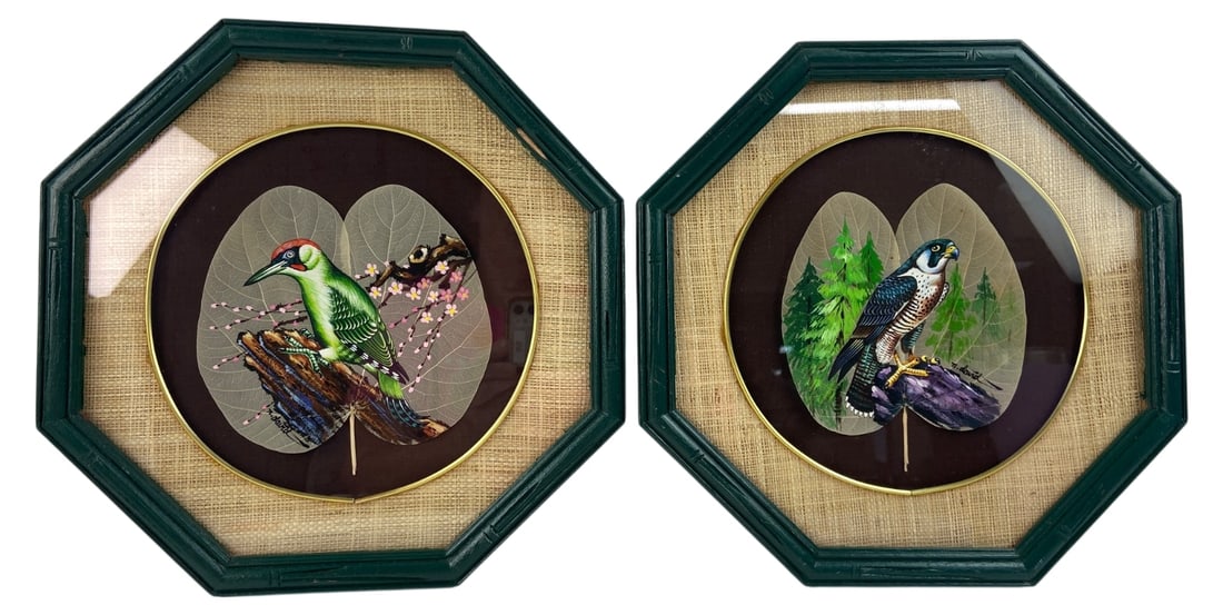 VTG N. David Painted Skeleton Leaf Bird Art Pr.: Pair of vintage hand-painted artworks on real skeleton leaves, signed N. David. Features a green woodpecker and a falcon perched on branches. Mounted on dark circular backgrounds with woven matting