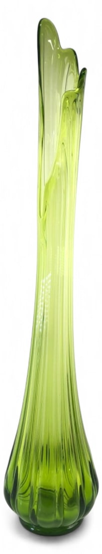 L.E. Smith MCM Green Ribbed Swung Glass Vase 31" H: Mid-Century Modern style swung art glass vase. Features a vibrant green color with a ribbed, bulbous base tapering to a tall, slender neck and an asymmetrical pulled rim. Unmarked base. Shows typical 
