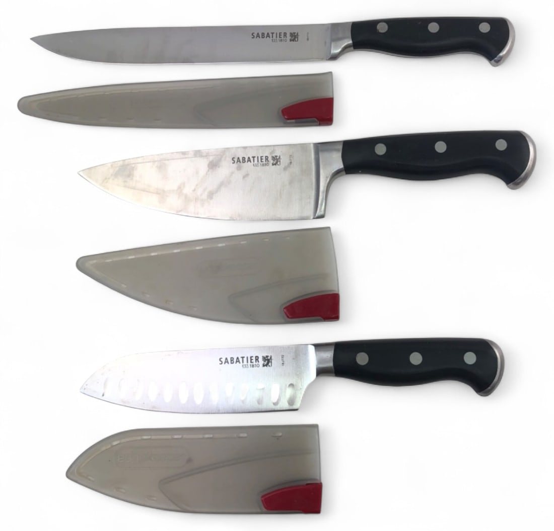 Sabatier 3-Piece Kitchen Knife Set with Guards: Set of three Sabatier kitchen knives including a slicer, chef's knife, and santoku. Features stainless steel blades, triple-riveted black handles, and Edgekeeper protective sheaths. Blades are stamped