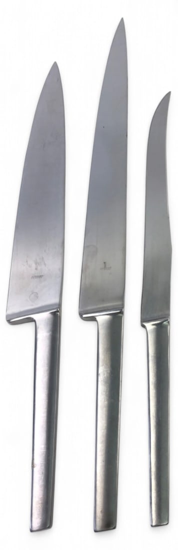 Austrian Stainless 3-Piece Kitchen Knife Set: Three-piece stainless steel kitchen knife set featuring a sleek, single-piece minimalist design. Stamped "STAINLESS AUSTRIA" with a monogram maker's mark. Includes chef, slicing, and utility knives. B