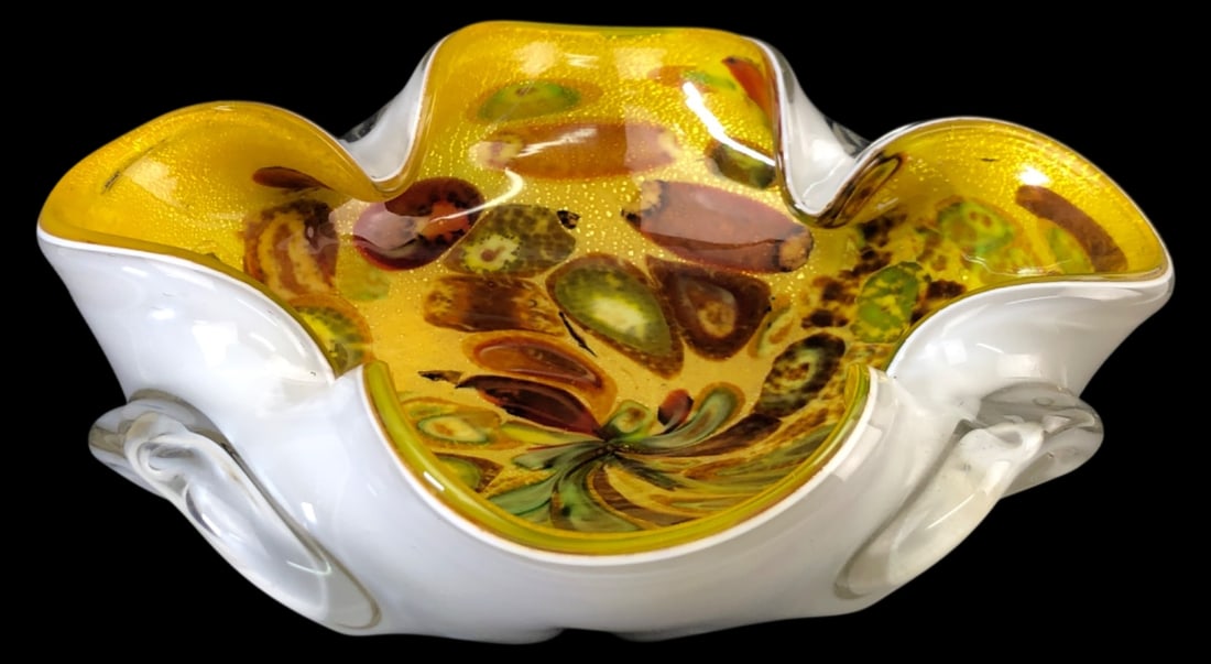 VTG Italian Gold Flecked Art Glass Bowl: Vintage Italian art glass bowl featuring a white cased exterior and a vibrant yellow interior with multi-colored inclusions and heavy gold aventurine flecking. Ruffled, folded rim design. Unmarked. Me