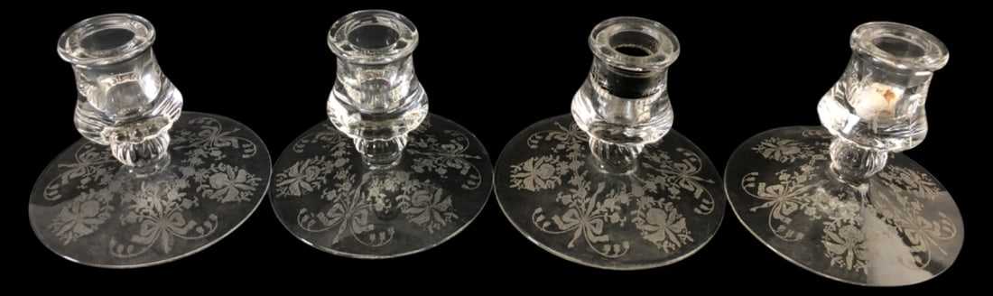 VTG Heisey Orchid Etched Candlesticks Set of 4: Set of four vintage clear glass candlestick holders by Heisey in the Orchid etched pattern. Features wide flat bases with intricate floral and ribbon etching, and bulbous stems. Measures 4"H. Good ove