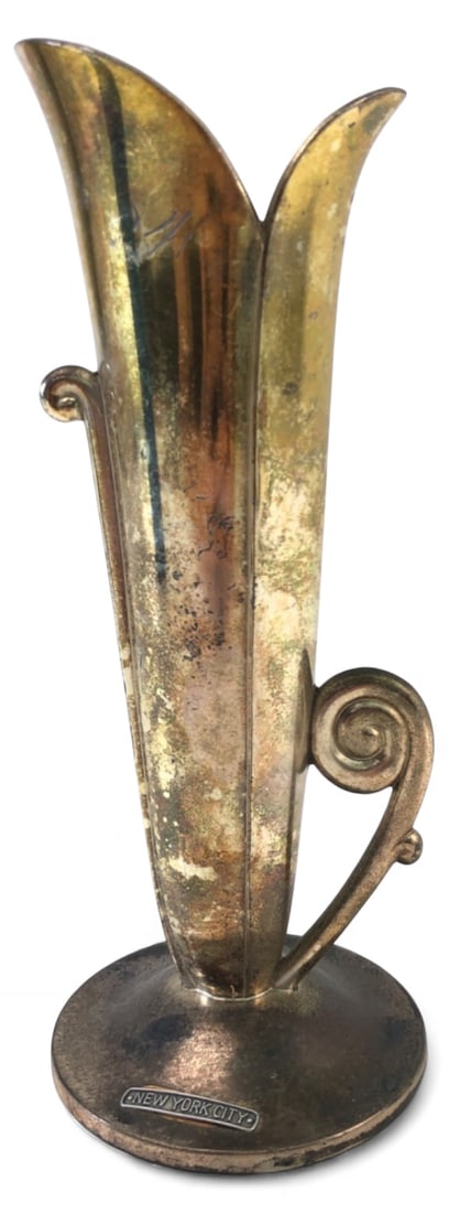 Occupied Japan Metal Tulip Vase 7 1/8" H: Metal tulip-form vase with a scrolled handle, made in Occupied Japan. Features an applied "New York City" souvenir plaque and is engraved "Cinderella July 1948" on the base. Stamped "Made in Occupied 