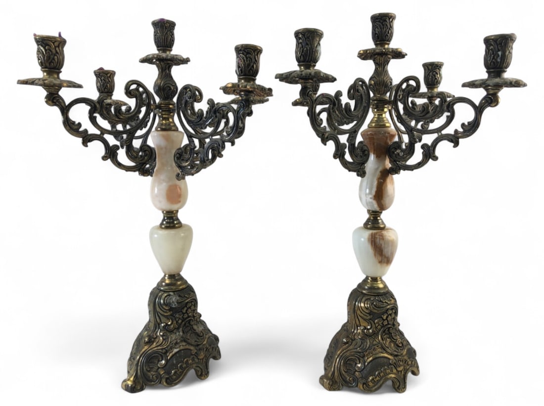 Italian Brass & Onyx 5-Arm Candelabras Pair: Pair of Italian Baroque style 5-arm candelabras featuring ornate cast brass construction with polished onyx accents. Made in Italy. Features heavy scrolling foliate motifs and floral bobeches. Measure