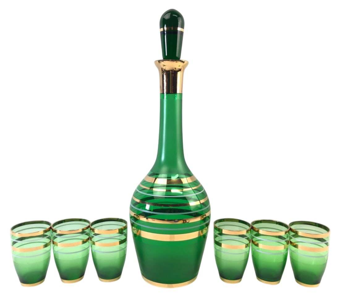 VTG Bohemian Emerald Green Glass Decanter Set: Vintage Bohemian emerald green glass decanter set. Includes one decanter with matching glass stopper (15" H) and six cups (3.25" H). Features horizontal gold and frosted bands. Unmarked. Shows minor w